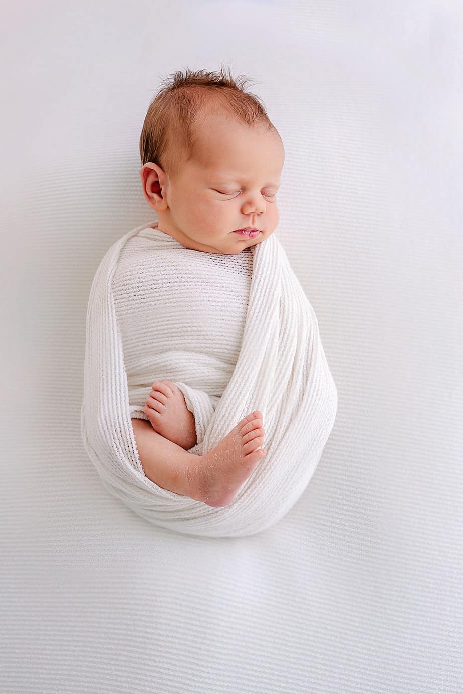 wrapped newborn baby in Pensacola FL studio