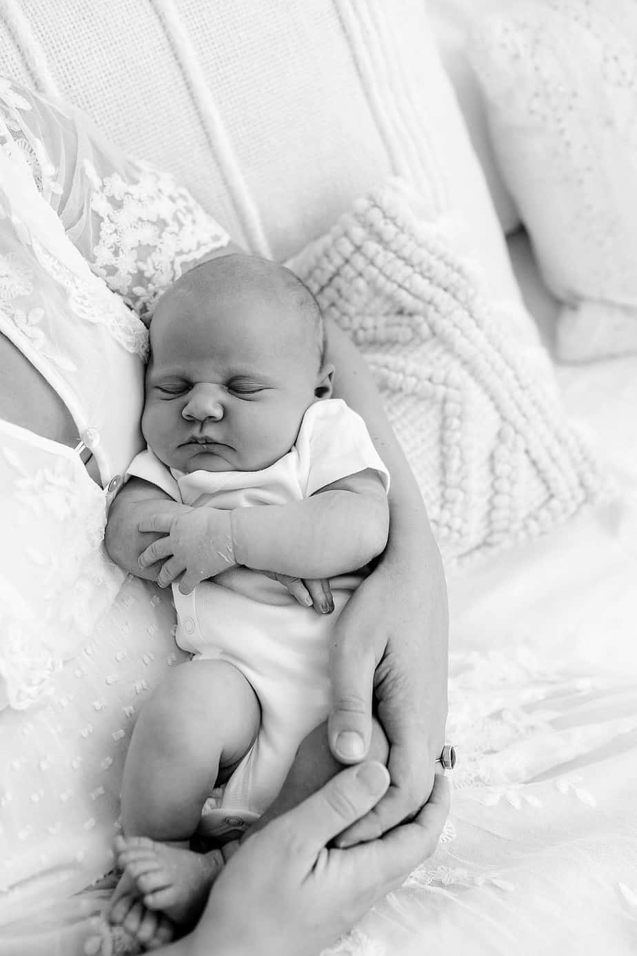 newborn in moms arms pensacola photography