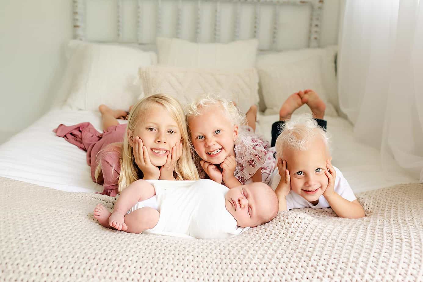 three siblings and newborn during pensacola photo session