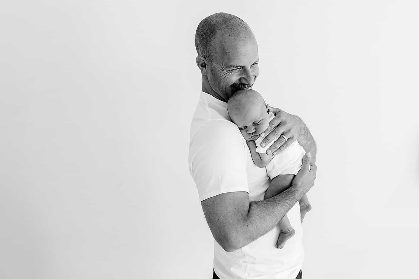 dad holding newborn baby pensacola photography