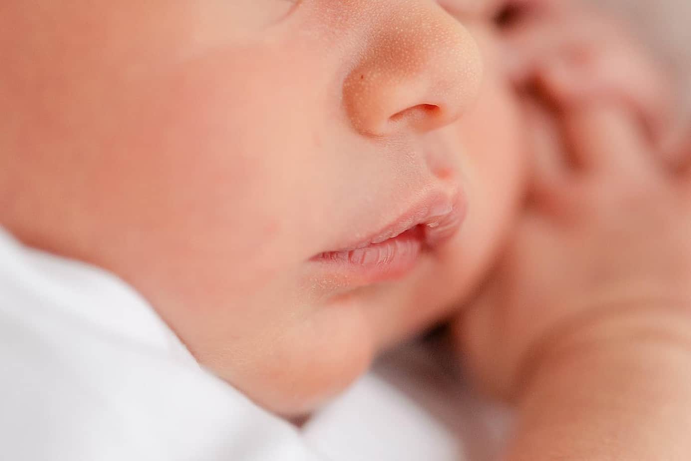 Close up of newborn baby lips pensacola photographer