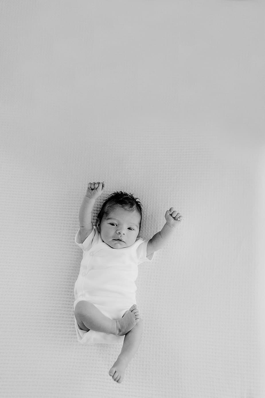 Newborn baby girl on white in pensacola photography studio