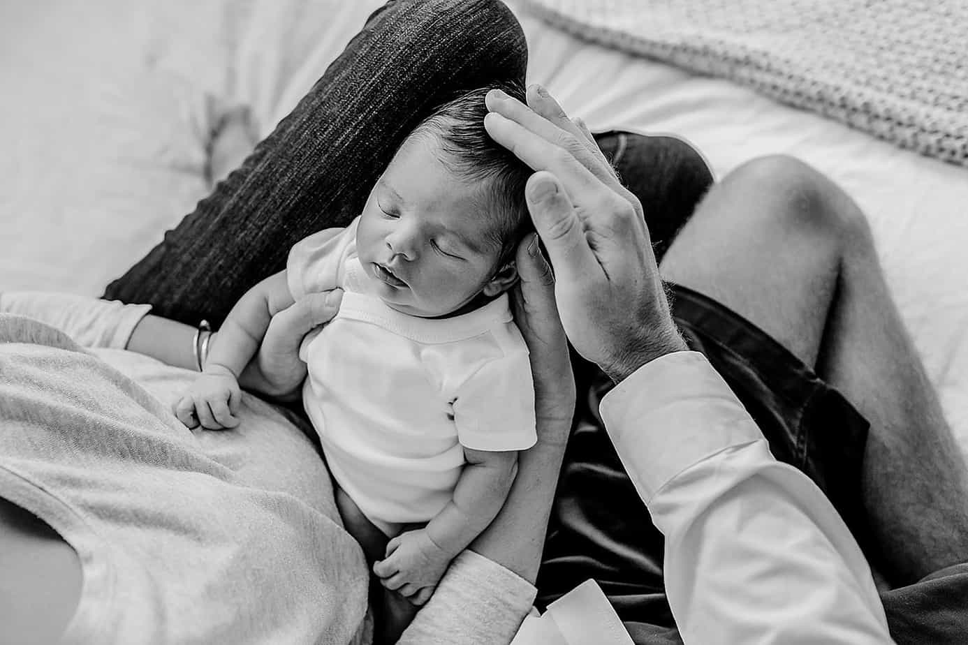 Newborn baby with parent's hands pensacola photographer